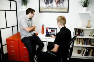 Big Red Jelly employees collaborating in office work environment.